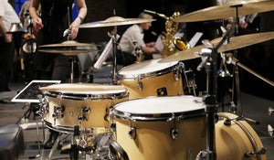 drum kit on a stage for a group performance