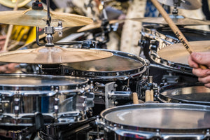 close up shot of a drum kit being played live